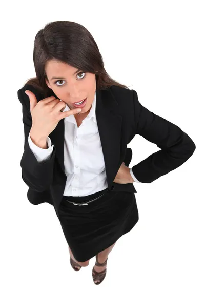 Businesswoman telling you to call Royalty Free Stock Images