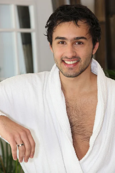 Smiling man in bathrobe — Stock Photo, Image