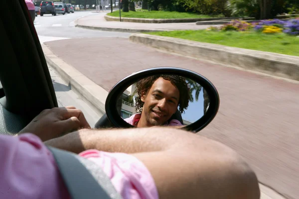 Man looking in his wing mirror — Stock Photo, Image