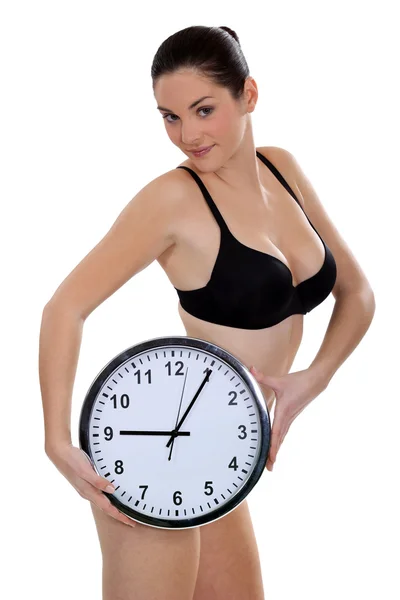 Brunette with clock Royalty Free Stock Images
