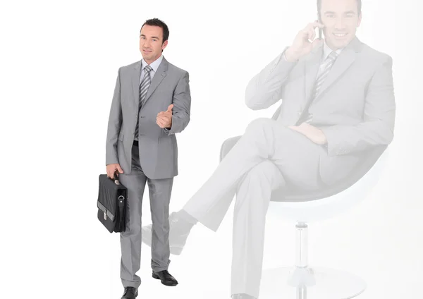 Businessman with briefcase giving thumbs-up — Stock Photo, Image
