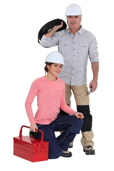 An electrician and his apprentice. — Stock Photo, Image