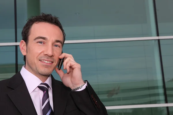 Confident businessman on phone — Stock Photo, Image