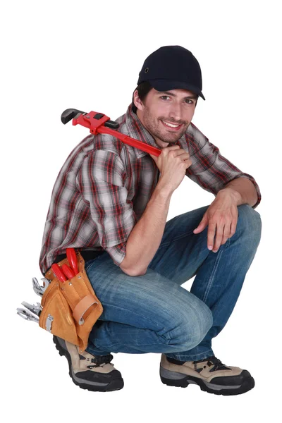 Handyman with a wrench — Stock Photo, Image