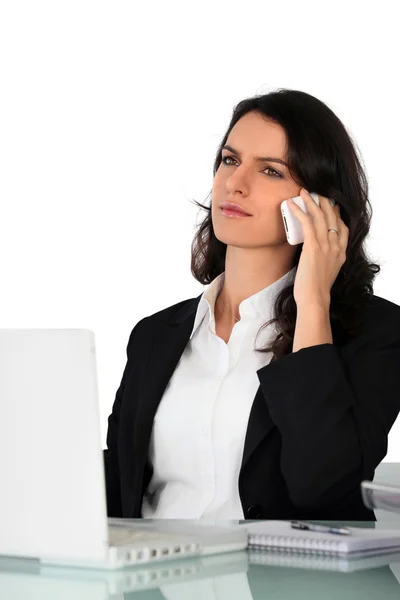 Secretary concentrated on the phone — Stock Photo, Image