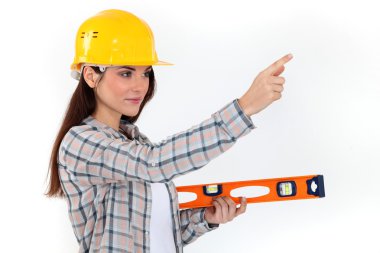 Young woman with spirit level clipart