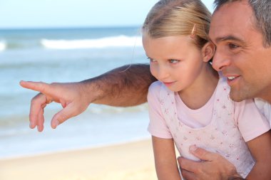 Father pointing something out to his daughter clipart