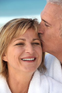 Husband kissing his wife clipart