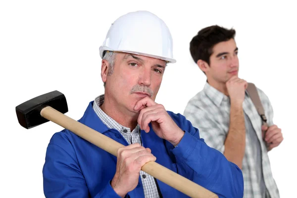 Builder and teenager deep in thought — Stock Photo, Image