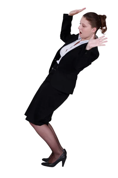 Businesswoman struggling to keep balance — Stock Photo, Image