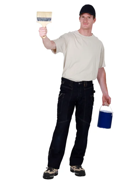 Craftsman painter holding a roller and a can — Stock Photo, Image