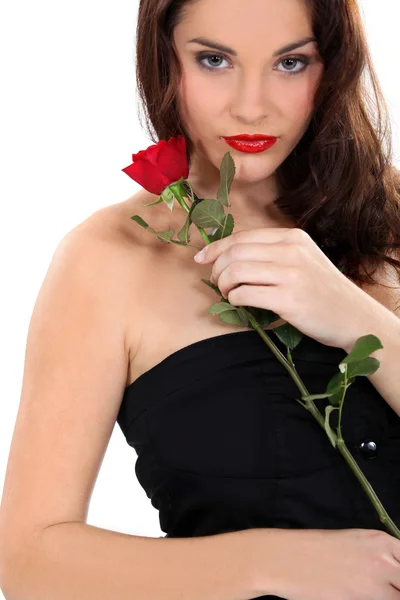 Brunette stood with single red rose — Stock Photo, Image