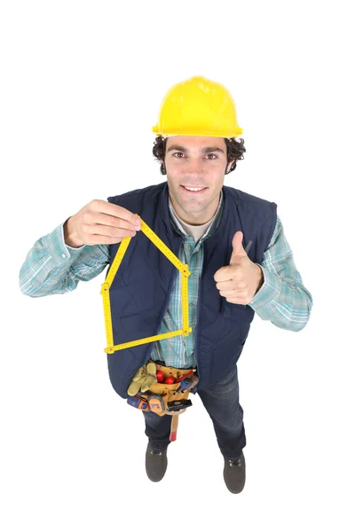 Trabajador de la construcción con su regla plegable — Foto de Stock