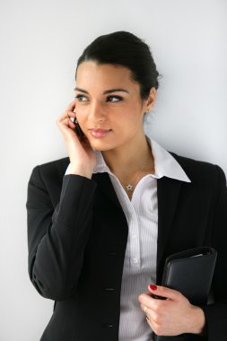 Businesswoman clutching diary clipart