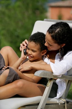 Mother and son making a phone call