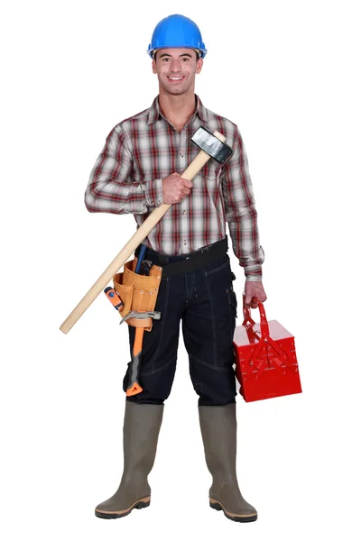 Labourer carrying tool-box — Stock Photo, Image