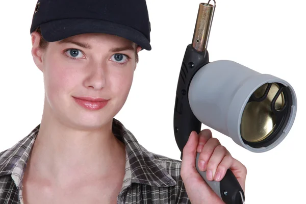 Woman with a blowtorch — Stock Photo, Image
