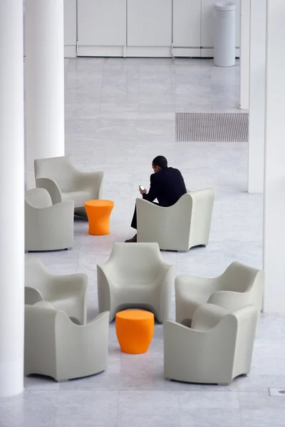 stock image Businessman in a modern office reception area