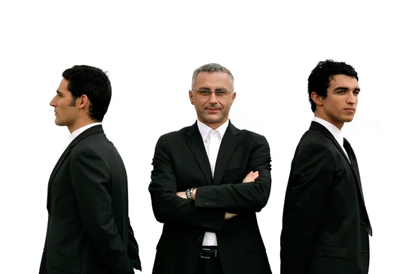 Three confident men standing on white background — Stock Photo, Image