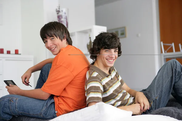 Stock image Two teenagers having fun at home