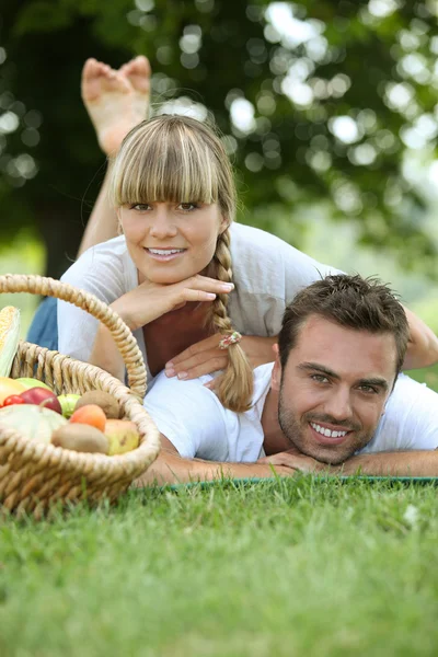 Couple having a picnic in the woods — Stock Photo, Image