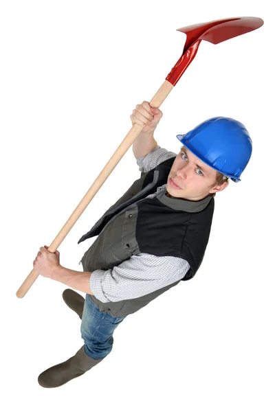 Worker raising spade in the air — Stock Photo, Image