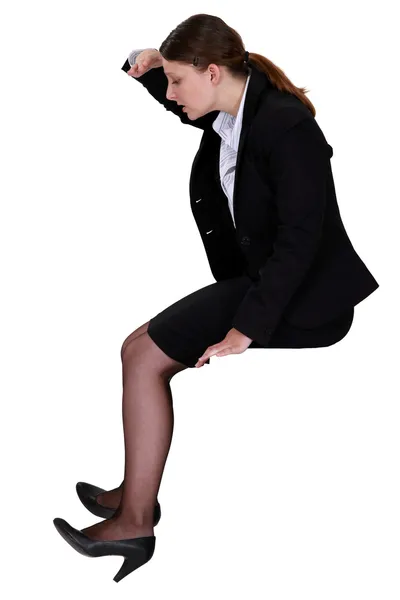 Woman sitting looking down — Stock Photo, Image