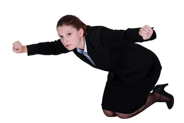 Businesswoman kneeling on the floor — Stock Photo, Image