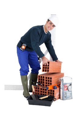 Portrait of a builder with materials clipart