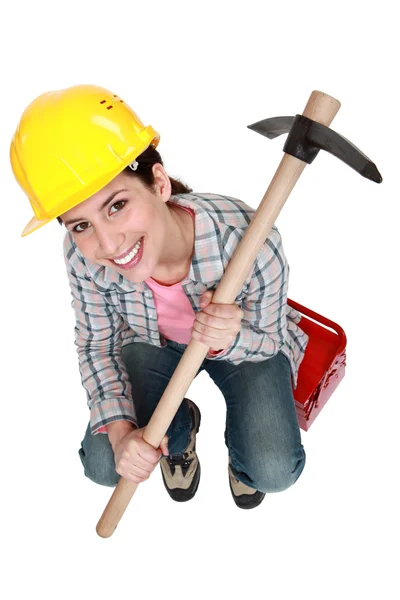 Woman holding pick-axe — Stock Photo, Image