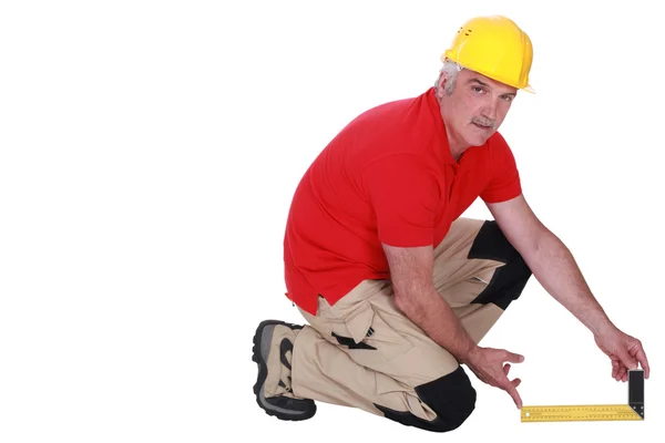 Tradesman holding a try square — Stock Photo, Image