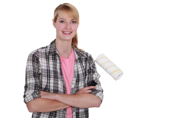 Woman using paint roller Stock Photo