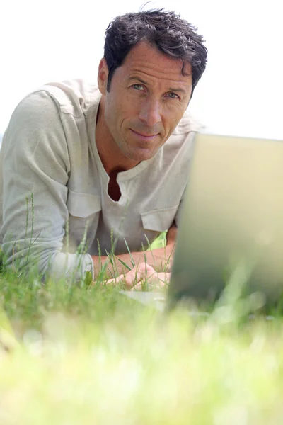 Man working on the grass — Stock Photo, Image