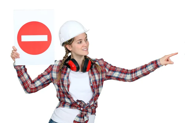 Traffic guard holding a no entry sign — Stock Photo, Image