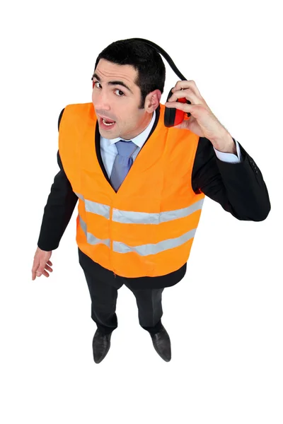 Airport worker with hearing protection — Stock Photo, Image