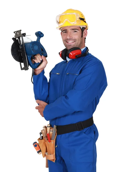 Jeune col bleu avec équipement de protection et ponceuse — Photo
