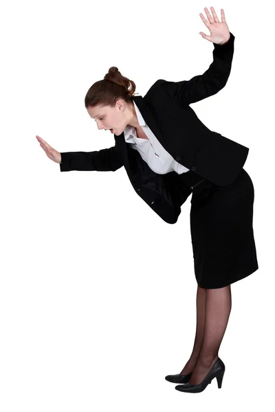 Businesswoman walking imaginary tight rope — Stock Photo, Image