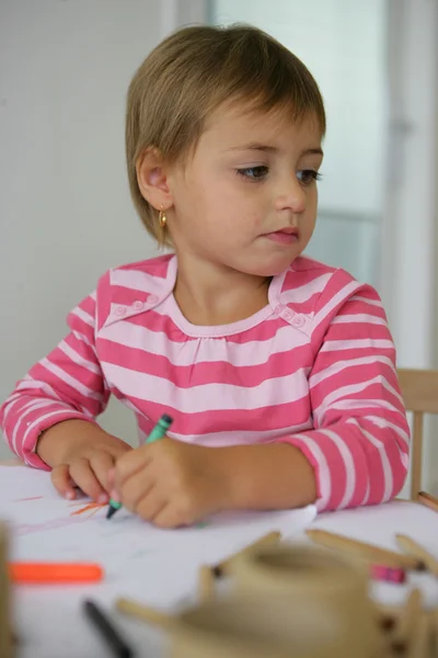 Little girl coloring in Stock Image