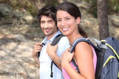 Couple hiking in the forest clipart