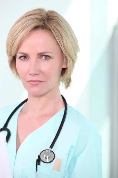 Woman with stethoscope Royalty Free Stock Images