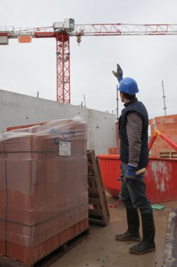 Worker making a sign to another worker clipart