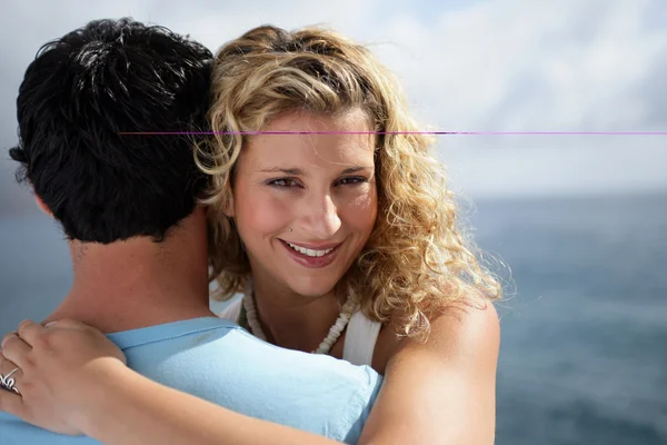 Young woman embracing her boyfriend — Stock Photo, Image