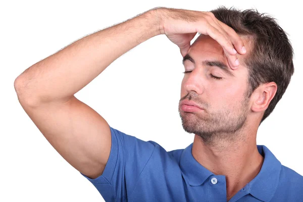 Studio záběr muže s bolestí hlavy — Stock fotografie