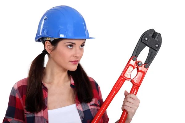 Brunette holding pair of bolt-cutters — Stock Photo, Image