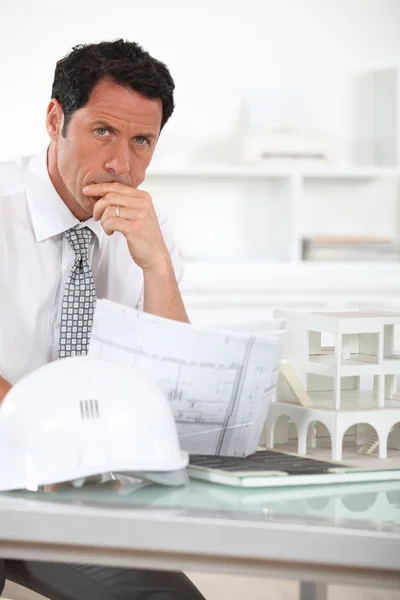 Architect with plans and 3D model — Stock Photo, Image