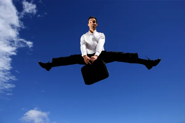 Экстатичный прыжок бизнесмена — стоковое фото