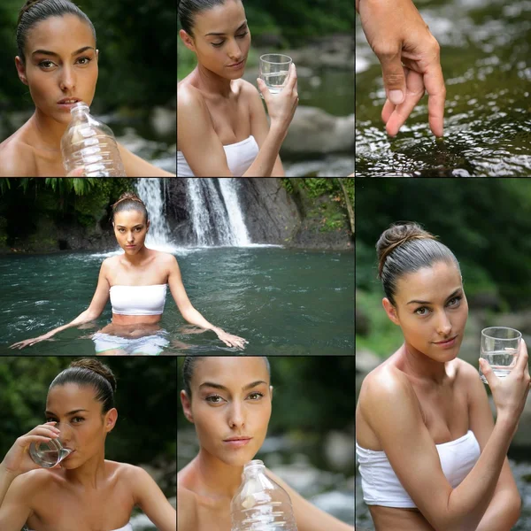 Ung kvinna dricksvatten nära ett vattenfall — Stockfoto