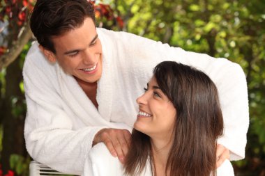 A couple in their bathrobes clipart