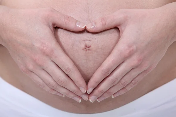 Zwangere vrouw raakt buik — Stockfoto