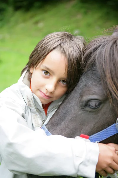 Little boy with horse — Stock Photo, Image
